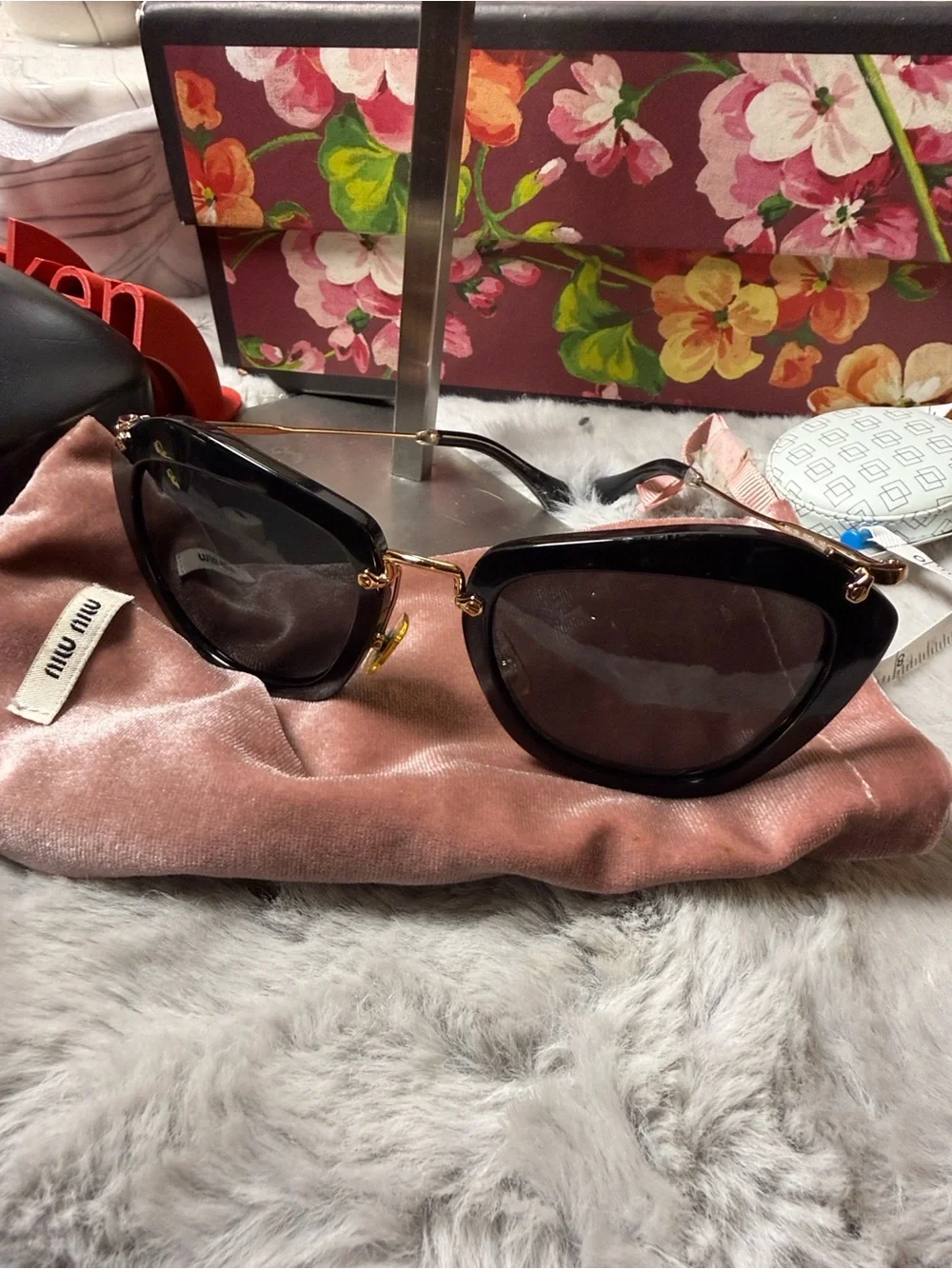 Miu Miu Black Cat-Eye Sunglasses with Gold Trim